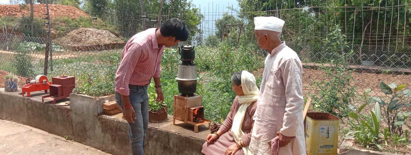 Observations and inputs being given by NIF team member on cooking stove cum water heater at Kausani, Uttarakhand