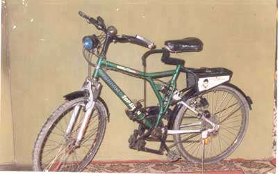 Bicycle with rider and terrain induced forces for transmission system - Photo