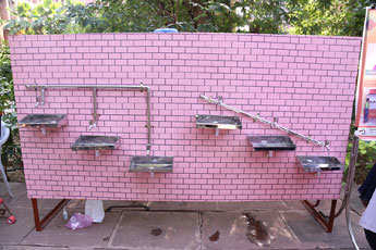 Inclined installation of water taps at schools and other public places - Photo