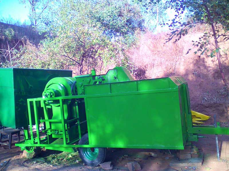 Image of Tractor mounted combine harvester with straw collector