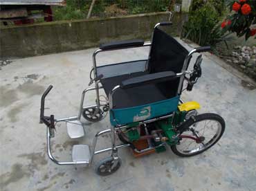 Improved wheelchair for the physically challenged and silk reeling cum spinning machine - Photo
