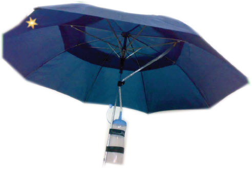 Rain harvesting umbrella - Photo