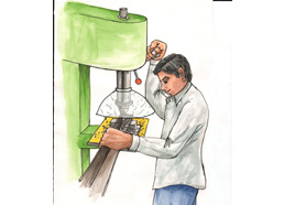 Attachment on drill machine to gather metal chips - Photo